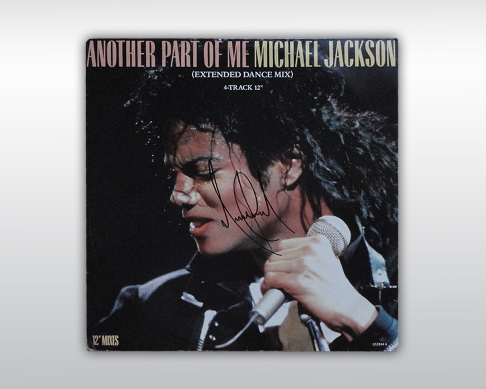 MICHAEL JACKSON SIGNED ANOTHER PART OF ME 12INCH SINGLE: Signed 'Another Part Of Me' extended dance mix single LP (4 track, 12", EPC 652544 6). The front of the record cover is signed by Michael Jackson in black paint pen "Michael Jackson". (Size: 12,5 by 1