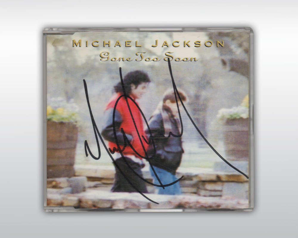 MICHAEL JACKSON SIGNED GONE TOO SOON CD: An original compact disc copy of Michael Jackson's 'Gone Too Soon' maxi single (EPIC 659976 2) signed by Michael Jackson on the front of the liner notes "Michael Jackson," in black ink. The CD case an