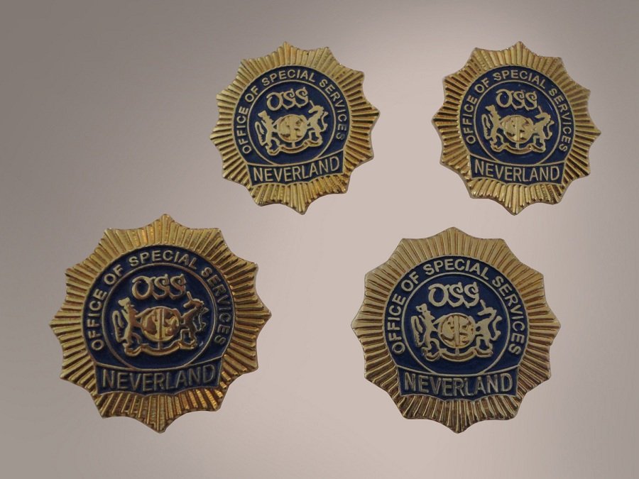 LOT OF 4 MICHAEL JACKSON NEVERLAND LAPEL PIN: Small but very rare pieces from the famous Neverland Valley Ranch. This auction is for 4 rare Neverland Office of Special Services (OSS) brooches. They have a single safety pin on the back. These broo