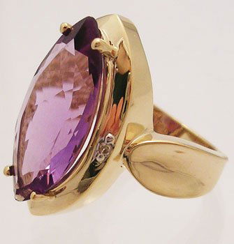 14ky 5ct Amethyst Marquise Diamond Cocktail Ring: LOW BUYERS PREMIUM (10%) NO RESERVE AUCTION! BIDDING STARTS AT $10! This 14k yellow gold ring is set with a huge 5 carat amethyst marquise that is accented on either side by a round pave set diamond.T