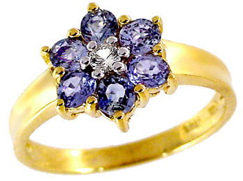 1.15ct Sapphire & white Sapphire flower ring: LOW LOW BUYERS PREMIUM (10% upto $499, 8% for $500 and up) NO RESERVE AUCTION! BIDDING STARTS AT $10! This elegant ring features bright clean pastel baby blue Sapphires set in a flower motif with a W