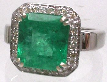 14KW 5ct Columbian Diamond .33ct Ring: LOW BUYERS PREMIUM (10%) NO RESERVE AUCTION! BIDDING STARTS AT $10! This is a Fine Emerald and Diamond Ring features a 5 carat cushion cut EMERALD that is stunning. This fine ring also features .3 car