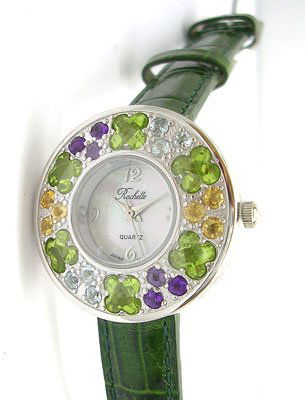 SSilver Mult-Gem Rochelle Ladies Round Dial Strap: LOW BUYERS PREMIUM (10%) NO RESERVE AUCTION! BIDDING STARTS AT $10! This beautiful and trendy Ladies Multi-Gemstone timepiece is exclusively designed by Jeremiahs International named Rochelle after on