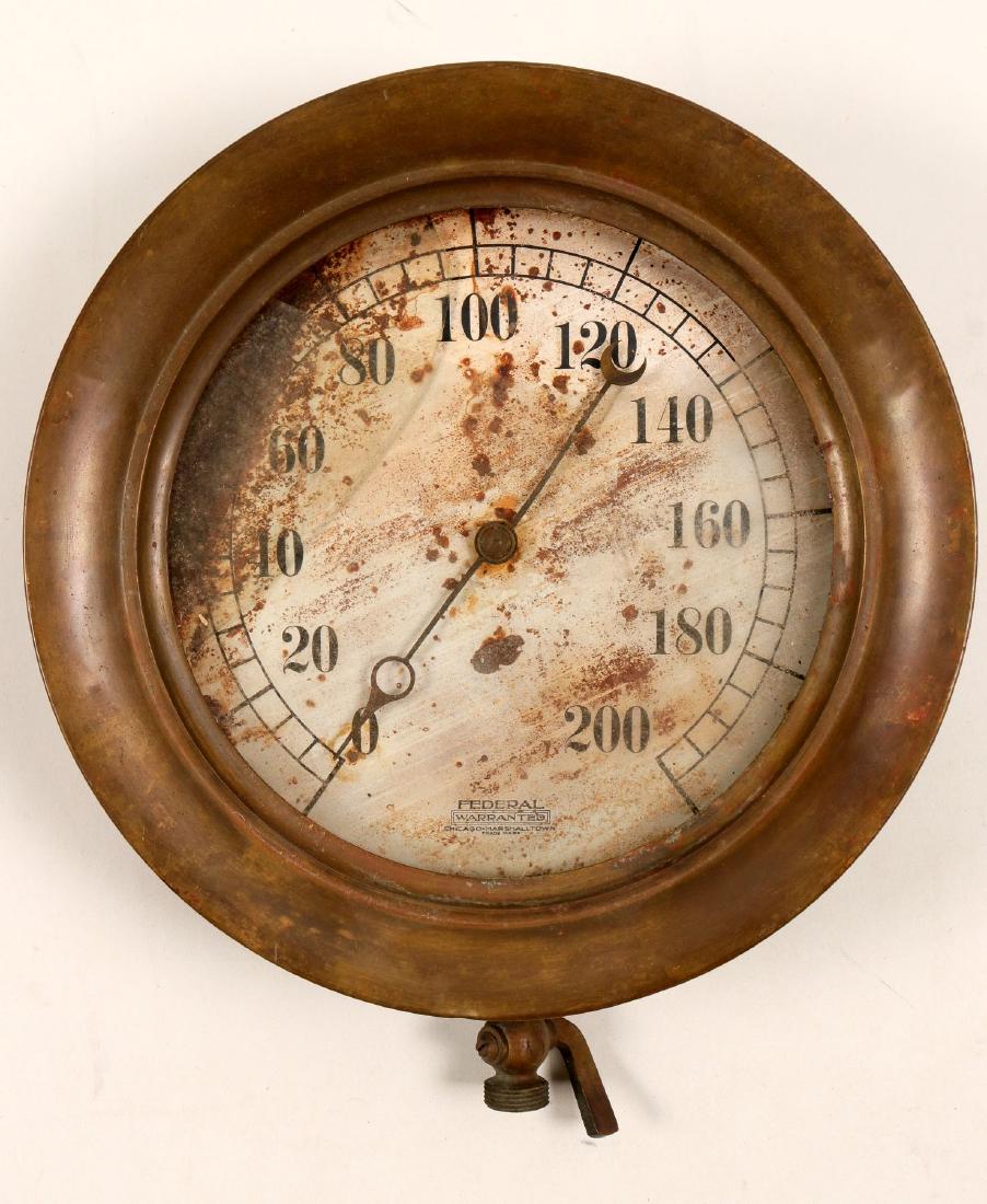 Steam Gauge from an Old Utah Mine (103130): This is a 10.5-inch diameter brass steam pressure gauge from an underground mine in Utah, possible the Mammoth Mine. Made by Federal. Cover glass is broken and interior dial is rusted. Brass rim is in