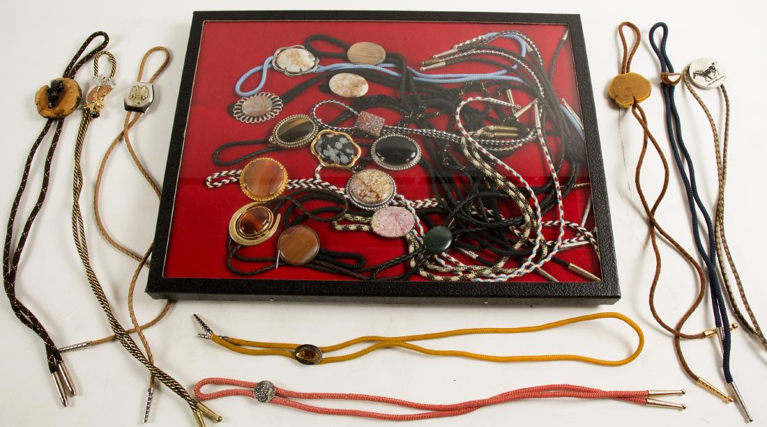 Bolo Ties Collection, 21 Ties (61343): 14 stone cabachon bolos-3 banded agate, 1 tiger eye, 4 agates, 1 petrified wood, 1 jet and more. Pretty group. Date: State/Country: City/County: