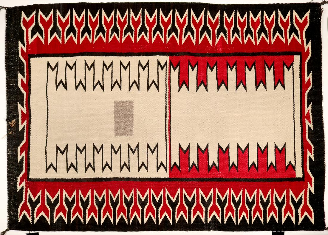 Navajo Rug (91334): Beautiful contemporary Navajo wool rug with slight wear that was repaired in one area (3" x 3" area near the edge. ) Has rectangular area of a gray color in the weaving near center. Approx. 37" width 