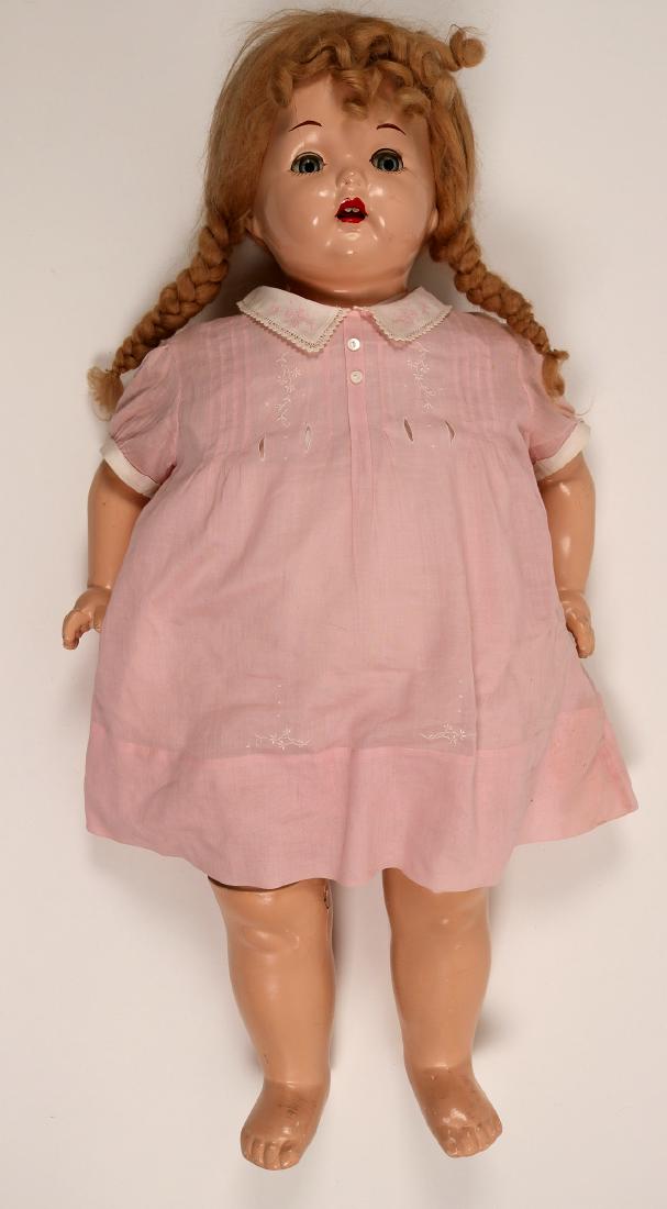 Doll / Original " Effanbee" (102149): Here is a very beautiful sweet doll. It is an original " Efanbee" . It it marked on the rear shoulder area. 28 1/2" tall, with blond haired wig, eye lashes, blue eyes, and with red lips open showing 2