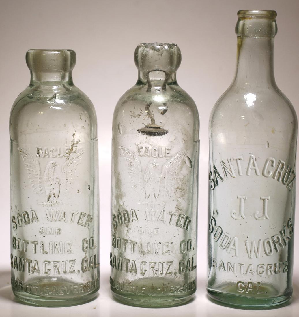 Eagle Soda Water & Santa Cruz Soda Works ( 3 items ) .: Item #1 of 3: Eagle / Motif : Eagle with spread wings, facing right./ Soda water ( cu) / and/ Bottling Co./ Santa Cruz, Cal / This bottle never sold // Aqua, Hutchinson type soda bottle. 6 3/4" tall a