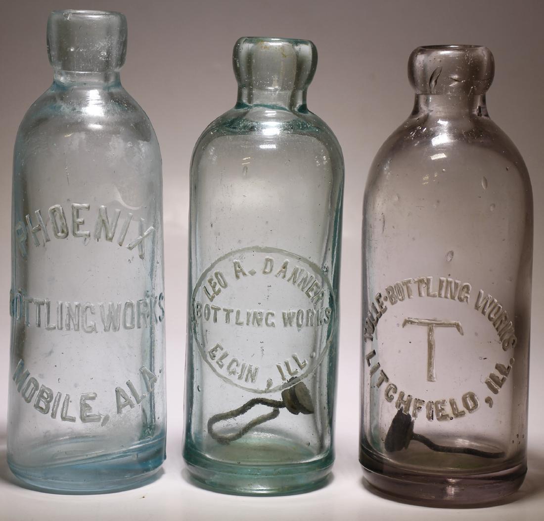 Phoenix, Leo A. Danner , & Tolle Bottling Works ( 3: Item # 1 of 3 : Phoenix ( au ) / Bottling Works / Mobile , Ala. ( ad). // Base embossed " B ", laying on the right side. Reverse at the base says: I . G. Co. // Aqua, hutchinson type soda. 7 1/8" tall