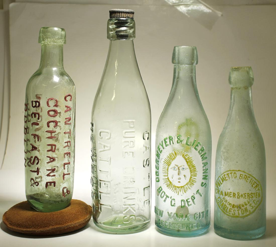 Cantrell , Castle , Obermeyer, & Palmeto ( 4 Items ).: Item # 1 of 4 : ( Embossed vertically ) Cantrell & / Cochrane / Belfast &/ Dublin / Medicated / Areated / Waters. // Aqua, round bottom soda, applied top. 9 " tall, and stained . This is a dug specime