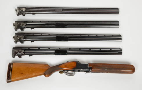 Browning 4 barrel Shotgun, Over/Under 1987 JMD-12472: Made exclusively for Simmons Gun Company. Browning Superposed O/U in 12/20/28/.410-gauges all with 26 in. barrels with elevated trap rib. Leather carrying case with individual zippered sections for th