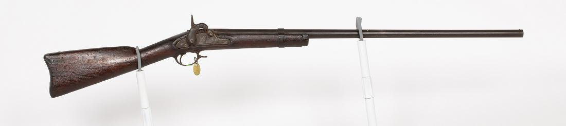 US Springfield 1863 Musket 1863 JMD-10400: This is a model 1983 Springfield in percussion, with a shortened stock. .58 cal. SN: N/A, JMD Oval Tag: 7099, Condition: Fair, >