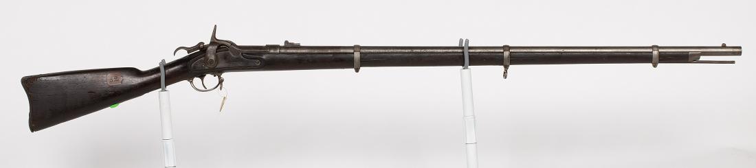 Springfield Rifle 1861 JMD-10385: This is the model 1861/1863 Springfield with the Roberts conversion. That conversion was to make the percussion Springfield into a center fire rifle. Very few were made and still fewer survive. SN: N/