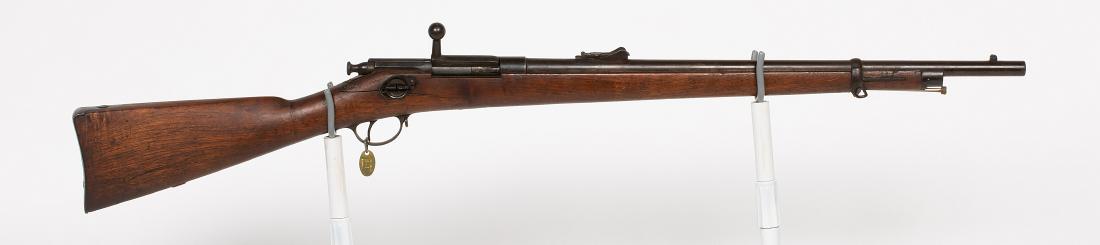 Winchester 1877, mfg 1879 Rifle 1870s JMD-12084: Winchester, 1877, Winchester-Hotchkiss 1879 (First Model) Carbine.45-70, tubular in-stock magazine, six-shot capacity. Original Stock/cleaning rod, Blade front/ladder rear sight, metal butt plate. Cra