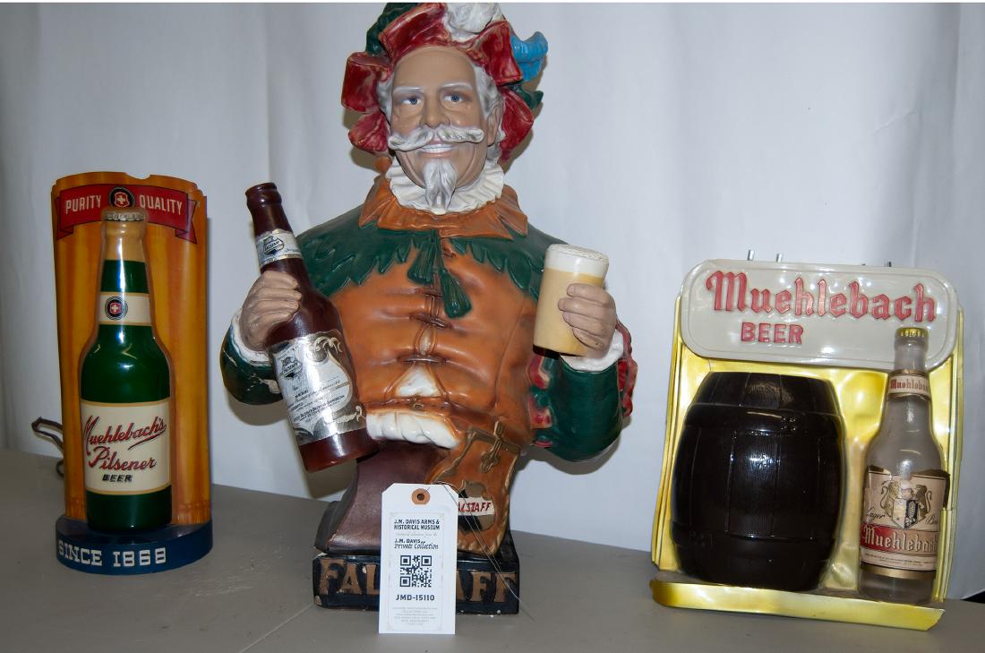 Beer Advertising pieces JMD-15110: Three beer advertising pieces. Falstaff plaster, some damage, repaired elbow holding the bottle, about 13 x 21". Muehlebach's Pilsner, plastic lighted advertising piece, chord is shot, 15" tall; anoth