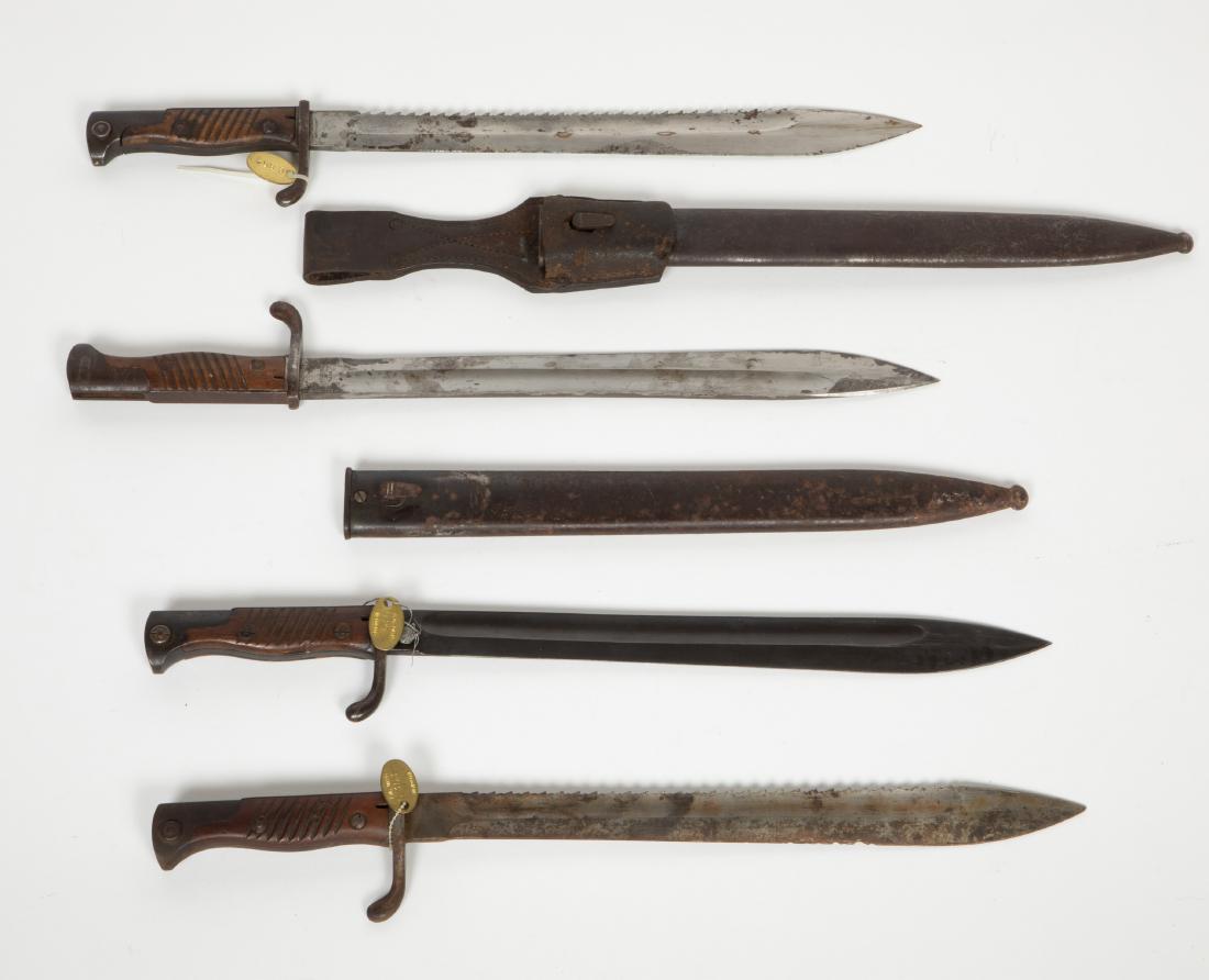 Military Bayonets (4) JMD-12200: A) 14" blade, no scabbard, Carl Eickhoen, Solingen; B)same style blade, metal scabbard, 14", "Gottleib/Hammesfahe/Solingen, Foche. C) Anker-Werke/ Bielefeld, serrated top of blade, 14" no scabbard; D)