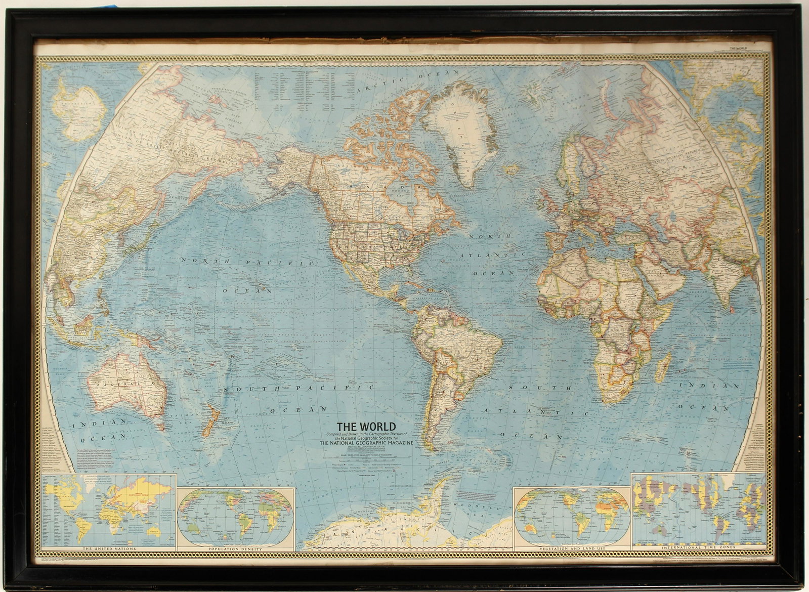 Map of The World #80964: 1965 map of the world, compiled by the National Geographic Society. Map includes International Time Zones, Vegetation & Land Use, Population Density, & the United Nations. 32.5" x 44.5" framed. State: