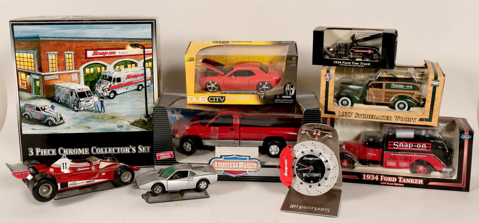 Snap On Tools Die Cast Metal Toy Collection #110625: Set of six "Snap On Tool" advertising pieces. 1) A Hot August Nights clock, in a disc brake design. 2) 1937 Studebaker Woody, die cast metal, in original box. 3) 1995 Dodge Ram 2500 SLT, 1:18 scale di
