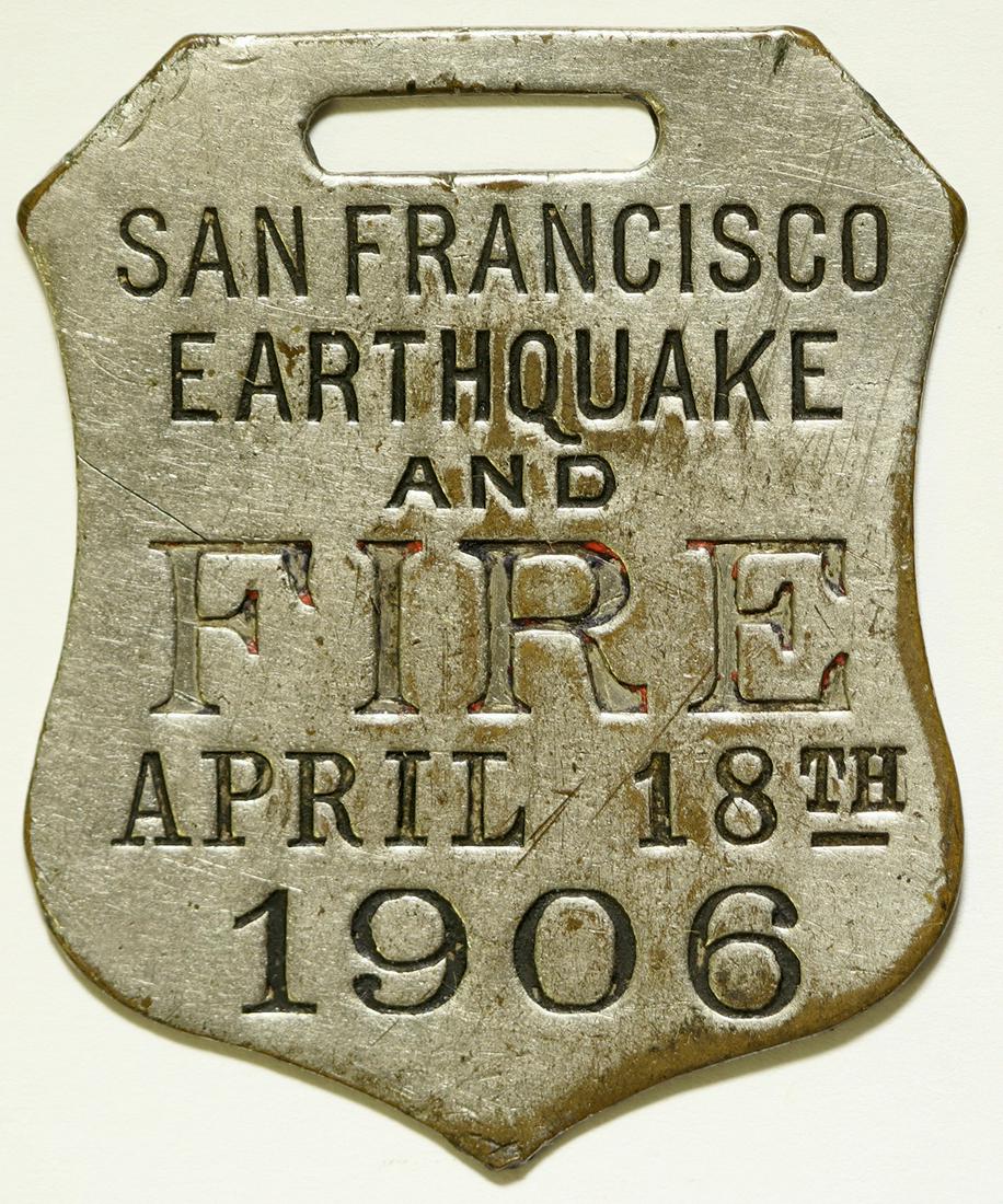 San Francisco Earthquake and Fire Fob (112081): Rare shield shaped white metal fob: San Francisco / Earthquake / and / Fire / April 18th / 1906. 1 3/4 x 1 1/2 inches. Provenance: John Reynolds Collection Country (if not USA): State: California City
