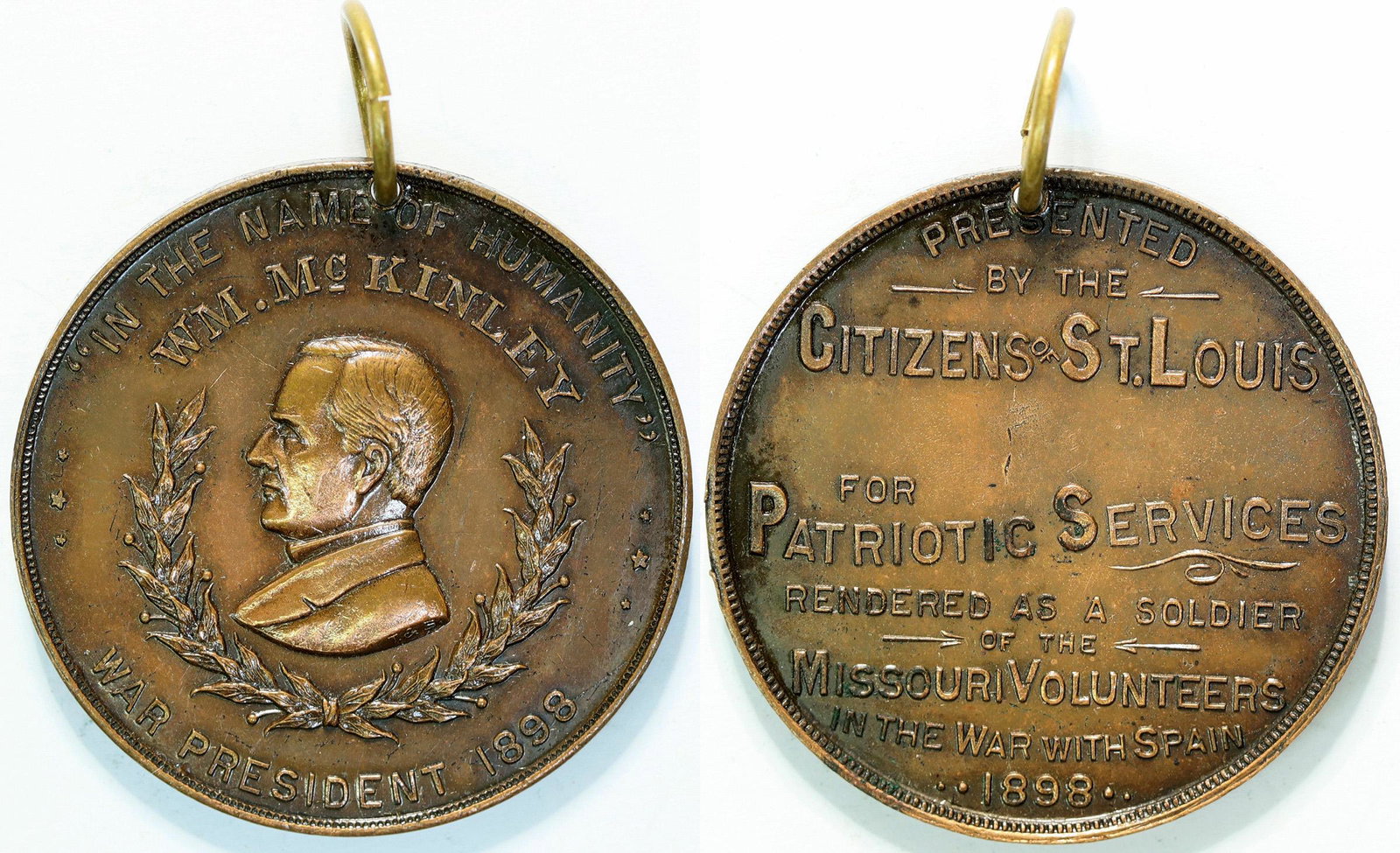 President McKinley Presidential Medal (112378): This is a patriotic medal presented to the citizens of St. Louis for Patriotic Services during the war with Spain by Missouri volunteer soldiers . 1 1/2 in. diameter of bronze with a jump ring. Proven
