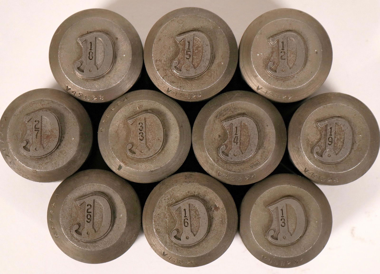 D Lettered Hobbs (10) (112222): Ten different hobbs with the letter D imprinted with a number on the top. Dies are sized differently. From the Northwest Territorial Mint Historical Die Collection. Provenance: Country (if not USA): S