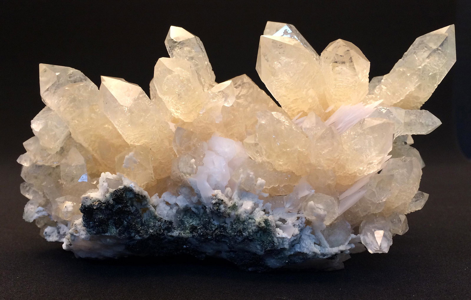 Quartz and Calcite from China (53057): The aesthetic beauty of this quartz crystal cluster from the Huanggang mine in Inner Mongolia is undeniable. Large, well-formed, lustrous, slightly-yellowish quartz crystals have formed in a spectacul