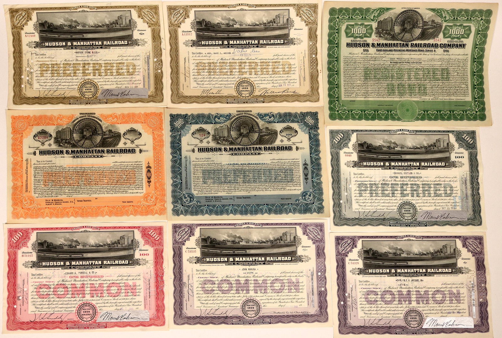 Hudson & Manhattan Railroad Co. (114453): 9 certificates. Incorp. 1906 New York and New Jersey. 3 w/vignette of frontal cutaway subway car w/rail yard and harbor on ether side. Orange, Blue stocks and Olive $1000, 5% Mortgage Bond, all unissu