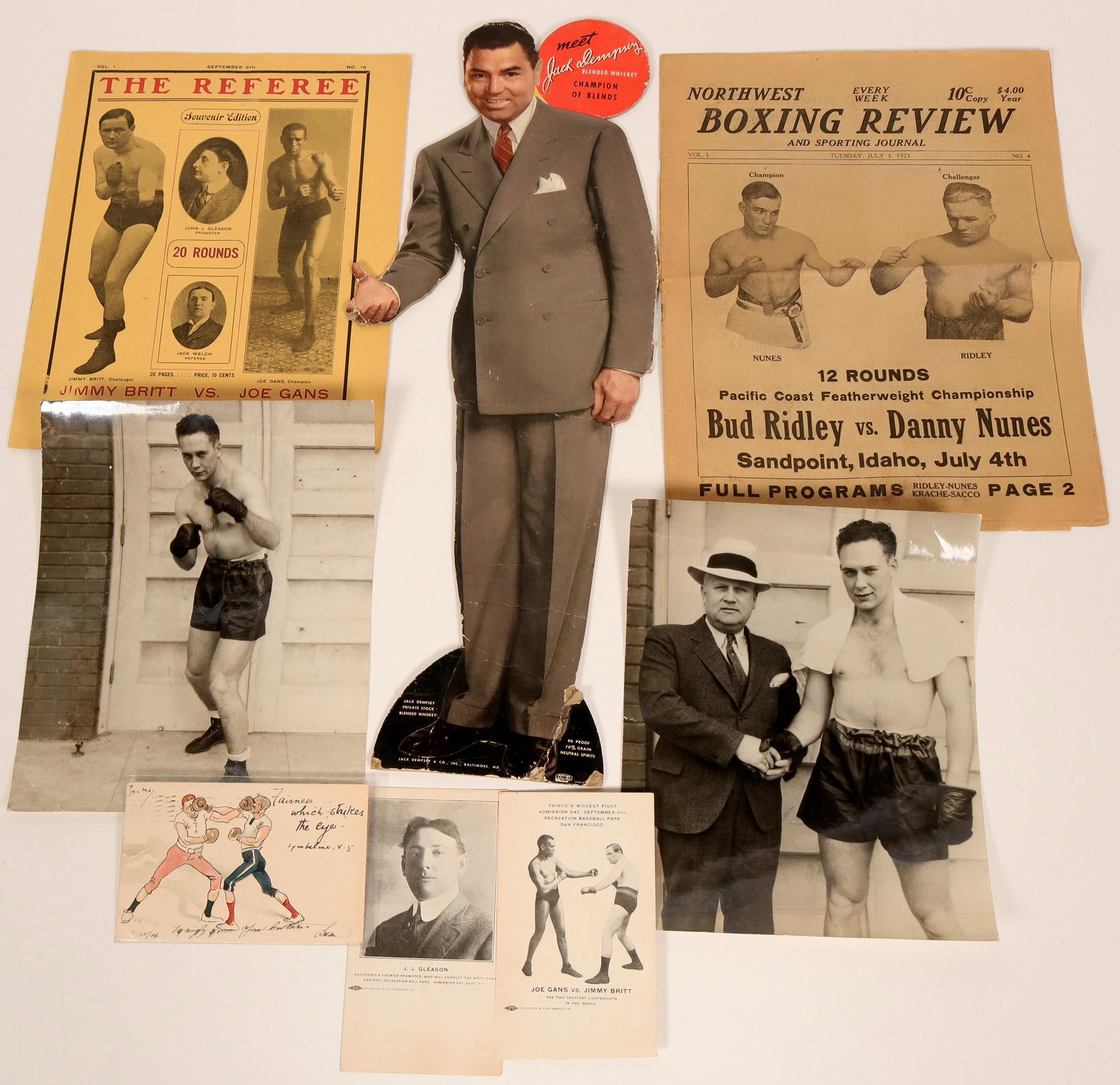 Boxing Grab Bag (8) (116450): Lot of 8 items. 1) Postcard promoting lightweight fighters: Joe Gans VS. Jimmy Britt. 2) Postcard of boxing promoter J. J. Gleason. Phillips & Van Orden Co. 3) Early 1900's postcard. 4) Northwest Boxi