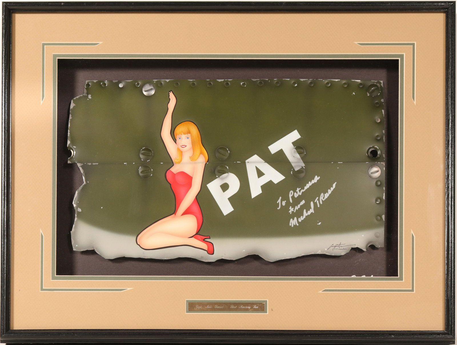 Nose Art "Pat" from Cpt. Michael Russo's plane: This is nose art from Captain Michael Russo's plane presented in a show box 20 in. X 26 in. The art is a blond in a bathing suit "Pat". the signature is of the artist and Russo's dedicaton: To Patrici