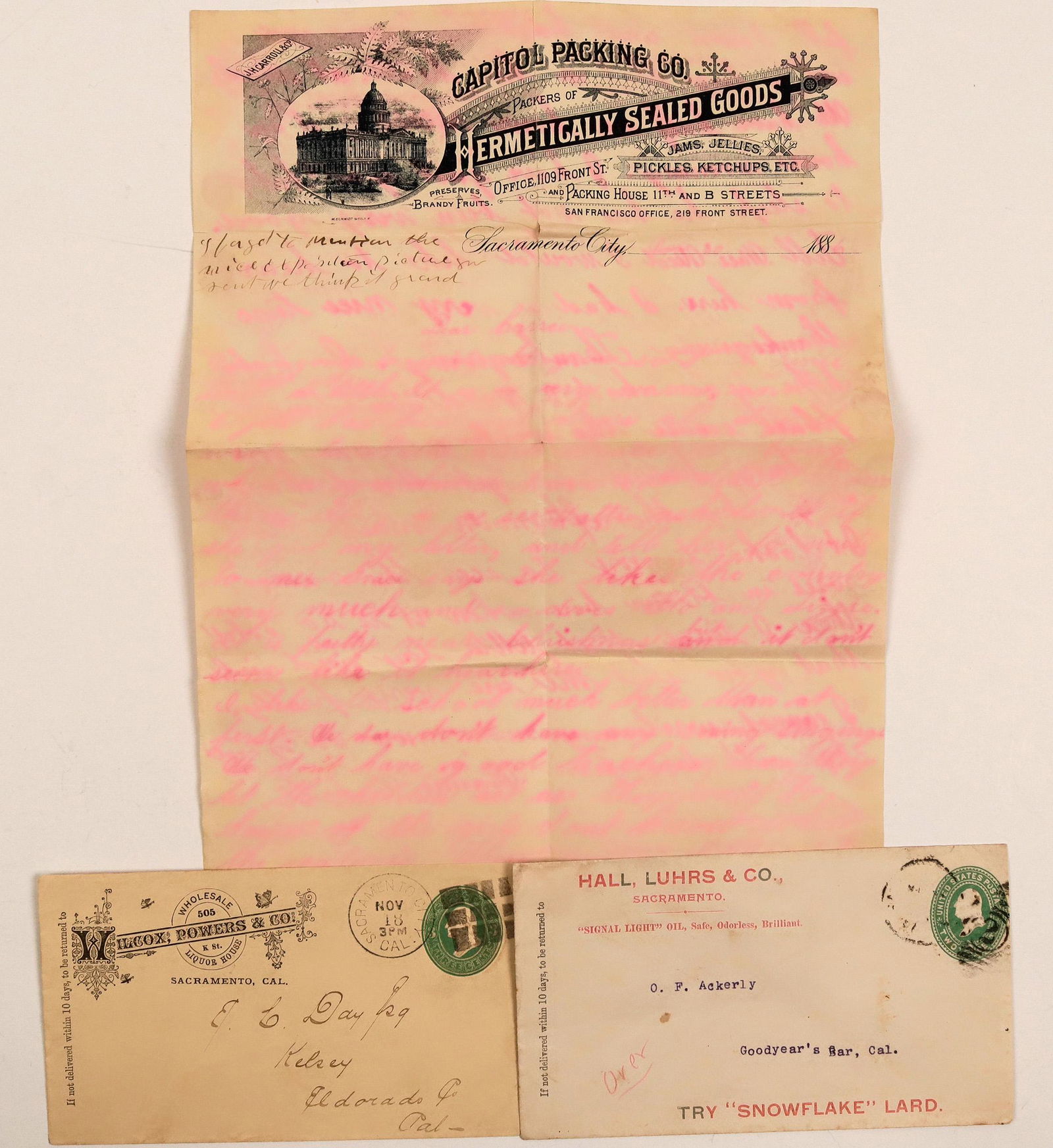 Sacramento Whiskey Advertising Covers (115136): Lot of 3. 1) Corner ad. cover for Hall, Luhrs & Co. Date illegible. Sent to Goodyear's Bar. Reverse has vignette of two pigs boxing (advertising their hams). No contents. 2) Corner ad. cover for Wilco