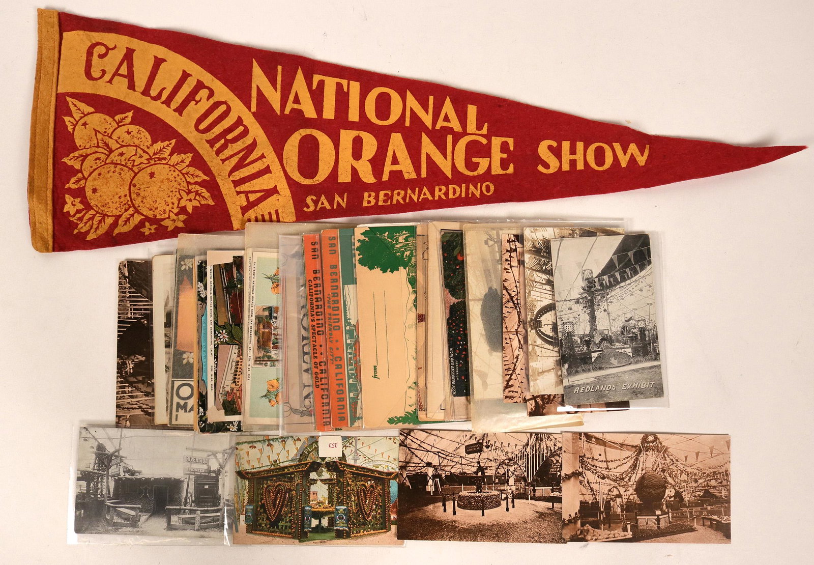 National Orange Show Postcards & Pennant (115560): This lot, dedicated to the 1913 National Orange Show in San Bernardino, is comprised of a colorful 24" pennant, 13 B&W RPCs, two postcardpacks and litho PC's. Most of the postcards are addressed and p
