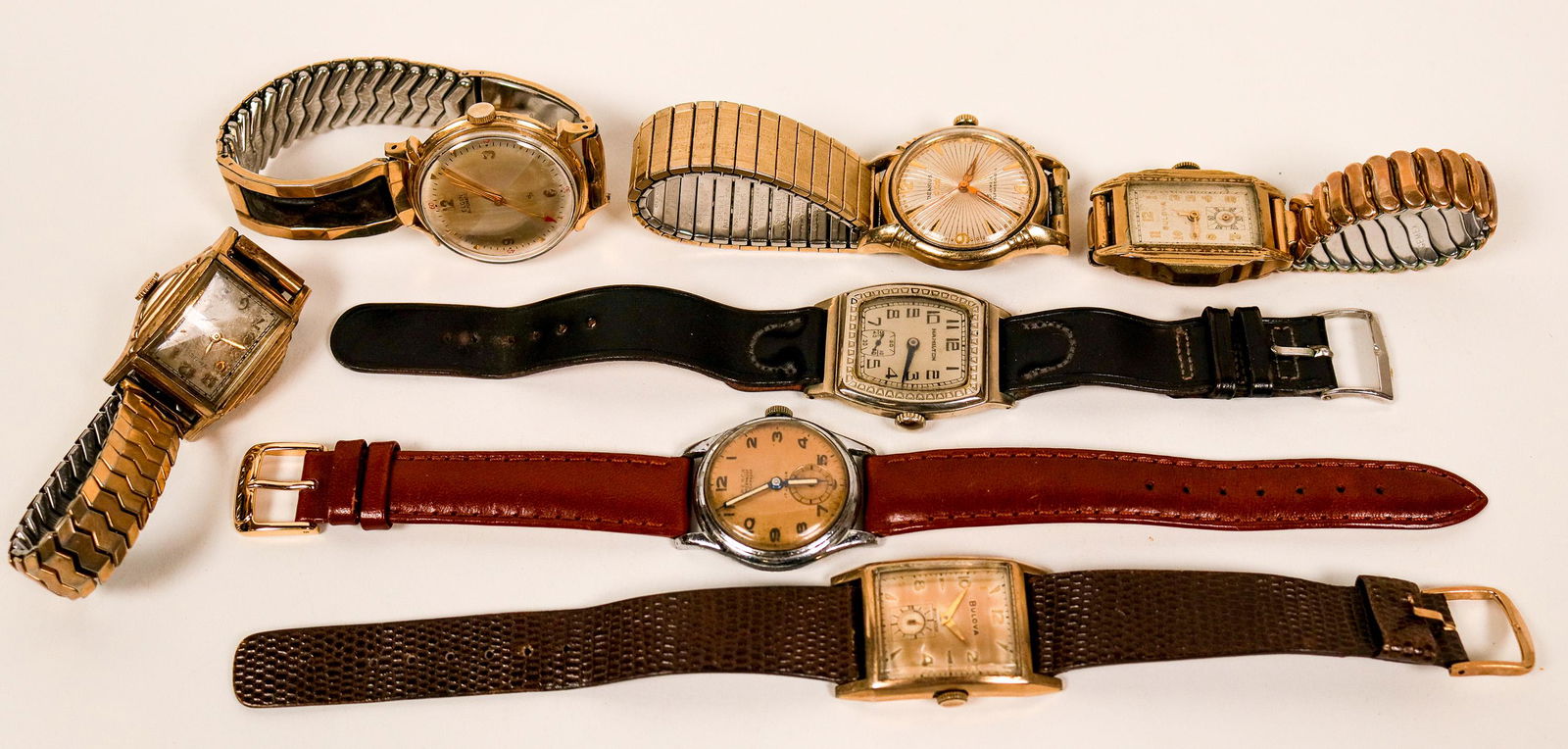 Vintage Men's Wristwatches (117328): Lot of seven vintage wristwatches, some self winding, some automatic, c1940s-50s. Most appear to be working. Watches include a 25-jewel Benrus, Gruen, Elgin, Hamilton, 17-jewel Frenca and two Bulova,