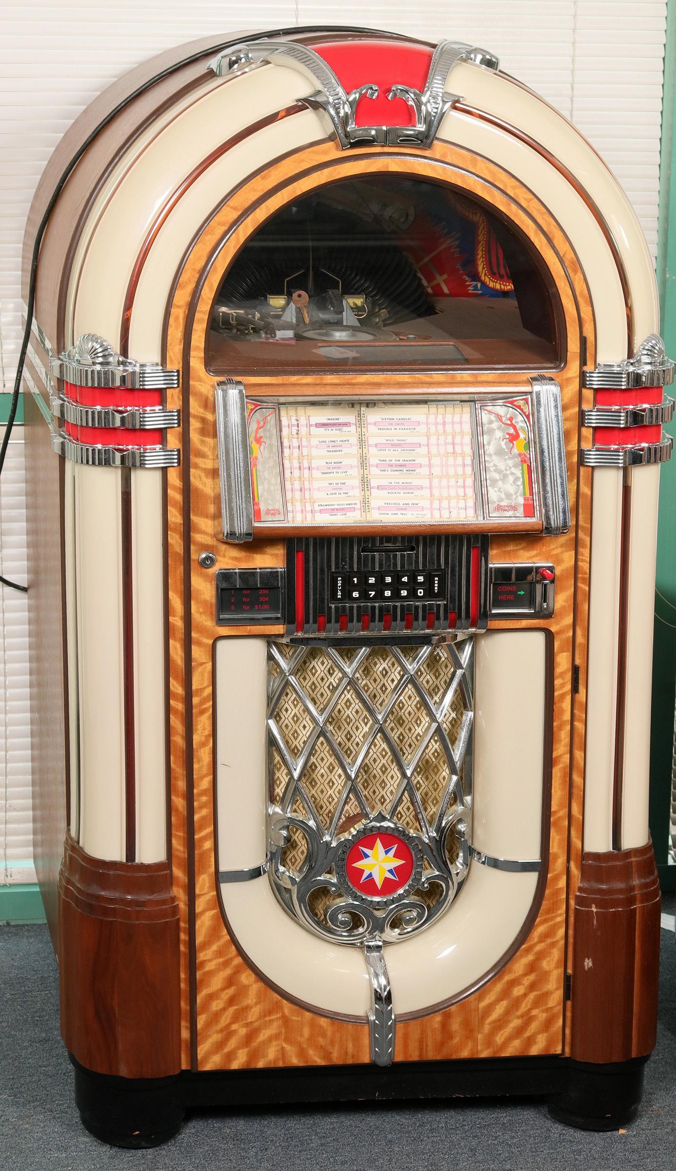 Antique Apparatus RB-80 45's Jukebox (119039): This is an Antique Apparatus Company Model RB-80 Bubbler jukebox. It is a reproduction of a Wurlitzer Model 1015 from the 40's. This box is geared to play 45's and there are some included. It was plug