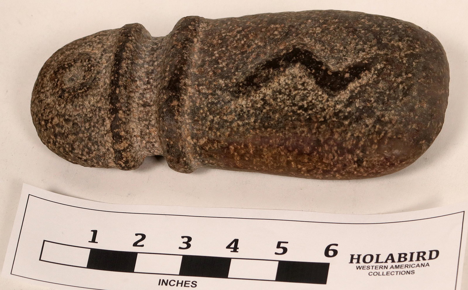 American Indian Grinding Pestle (119051): This is a beautiful American Indian grinding pestle with a nice carved lightening bolt design. It measures 9"x 3.75" and has a smoothed end which indicates grinding use. Sort of an early food processo