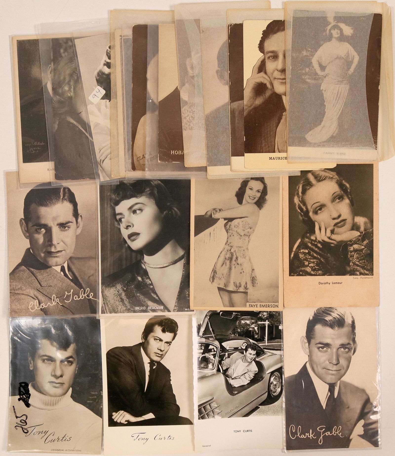 Film Stars Postcards (24) (111713): Lot of various film stars on postcards. Includes three cards with Tony Curtis and two with Clark Gable. Notable female film stars includes Joan Crawford, Ingrid Bergman, and Lauren Becall. See photos.