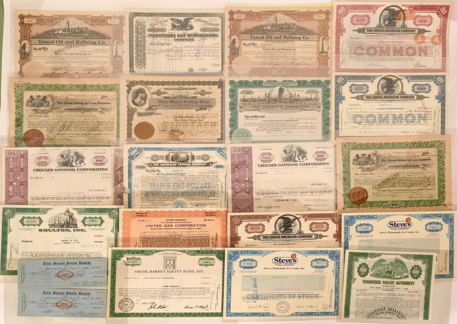 A Bevy of Industrial Stock Certificates (118846): A group of 20 stock certs issued by various industrial and financial institutions like Texcal Oil & Refining, Pennsylvania Salt Manufacturing, New Citizens Building & Loan, Tennessee Valley Authority 
