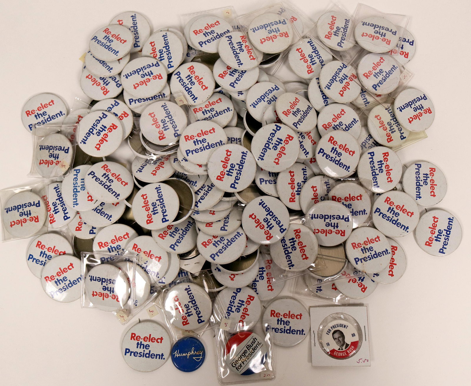 A Bushel of Bush Pin Backs (118122): These are pin backs touting the re-election of the 41st president of the United States George H.W. Bush in 1992. This was en election he lost to Bill Clinton. The badges are plentiful and brightly col