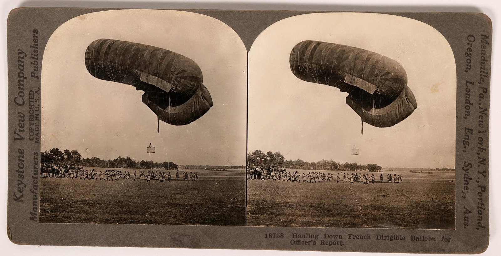 Stereo-view photo of a Kite-Balloon used for military: In this WW1 vintage stereo-view a crew is hauling-in a kite-balloon used by the military officers for reporting enemy positions and ordinance guidance.Provenance: John Reynolds CollectionCountry (if n