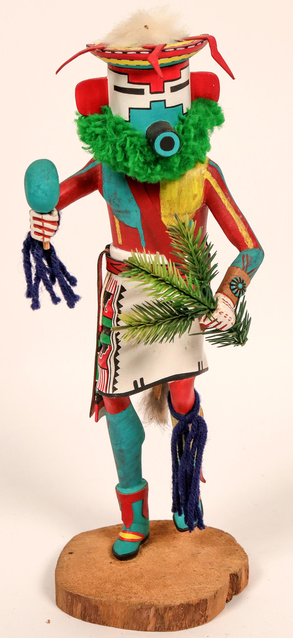 Snow Kachina by Garfield Nish (120830): Nice kachina by garfield Nish. 13" x 5" x 5.5". Hand carved and painted. Small amount of fur missing. Good condition.Snow kachina (Nuvak[x=#8217/]china) is an important figure in winter dances. Becaus