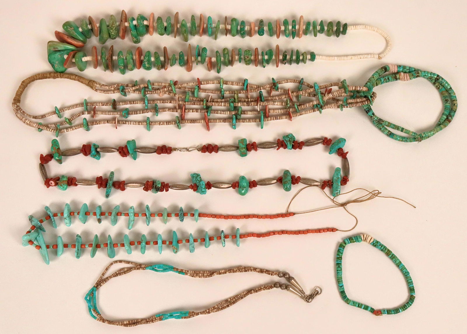 Five Vintage Native American Necklaces (121104): 1) Navajo turquoise and abalone shell large (approx. 1") flat nuggets with white heishi. 26" long . 2) Santo Domingo turquoise and shell heishi with turquoise and spiny oyster larger flat beads inters