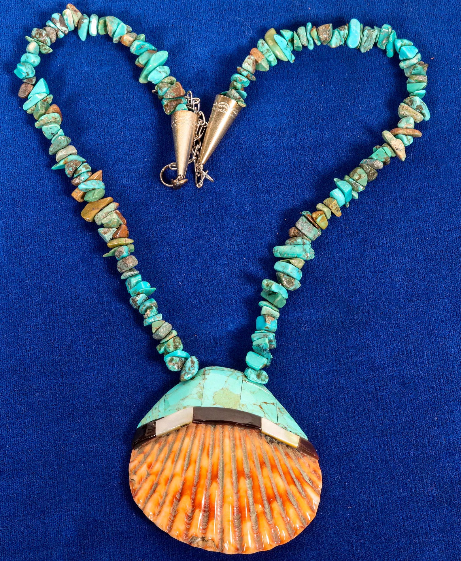 Santa Domingo Shell Necklace (121998): Vintage and traditional Santa Domingo shell necklace with mother of pearl, jet, turquoise and spiny oyster on a turquoise nugget chain, top to bottom about 13[x=#8221/].Date: Country if not USA: State