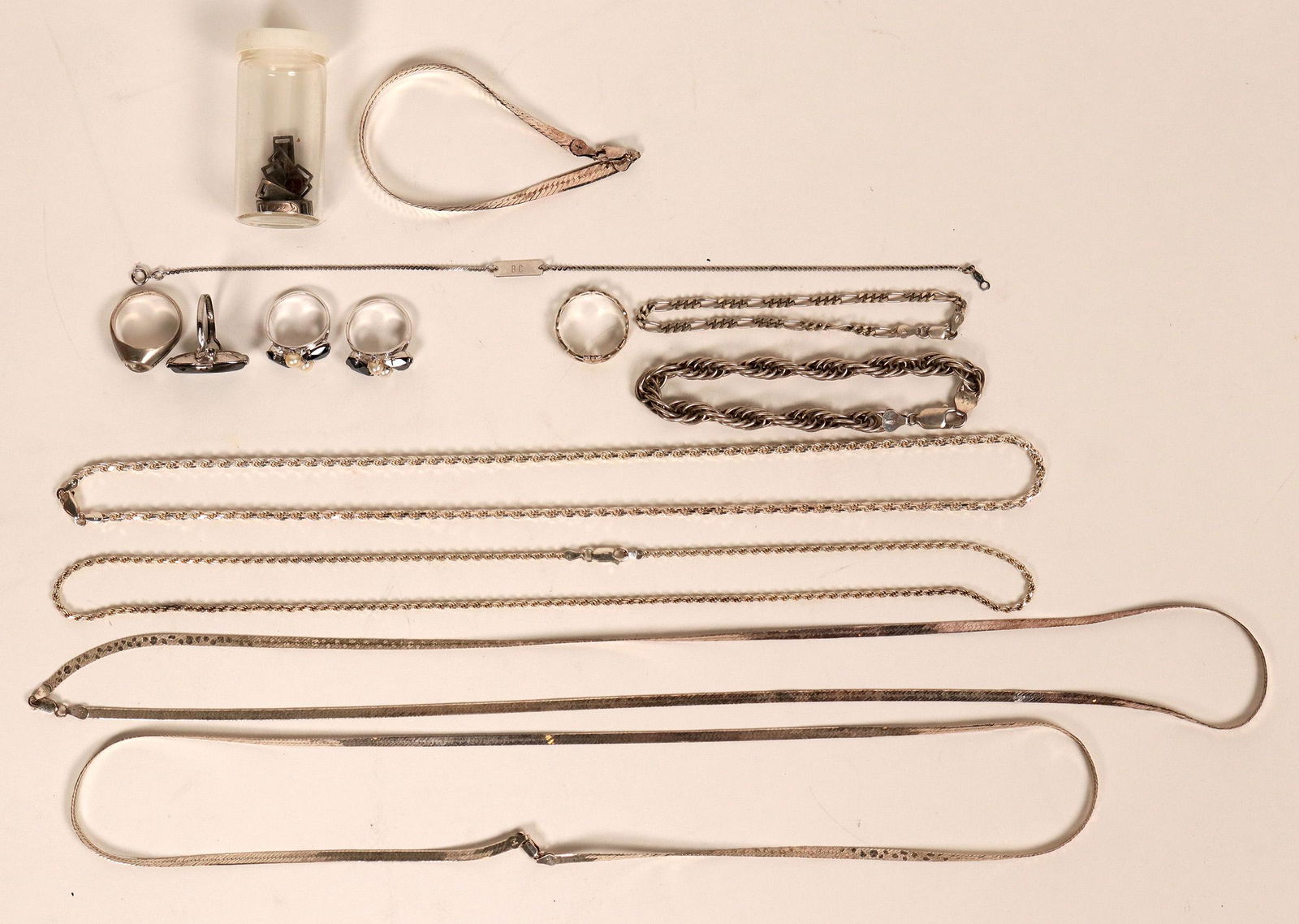 Sterling Silver Jewelry (12 pieces) (121228): Five rings, four set with stones; three chain bracelets, four very nice heavier chain necklaces. Please inspect!Date: Country if not USA: State: City: Provenance: