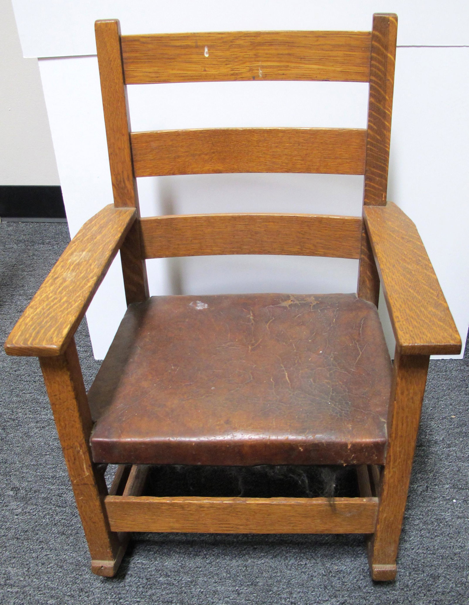 Child's Rocking Chair (75217): Oak and leather construction, in the style of Stickley, all original, no makers label. Overall width 18, overall height 24, overall depth 18. Excellent condition.Date: Country if not USA: State: City: