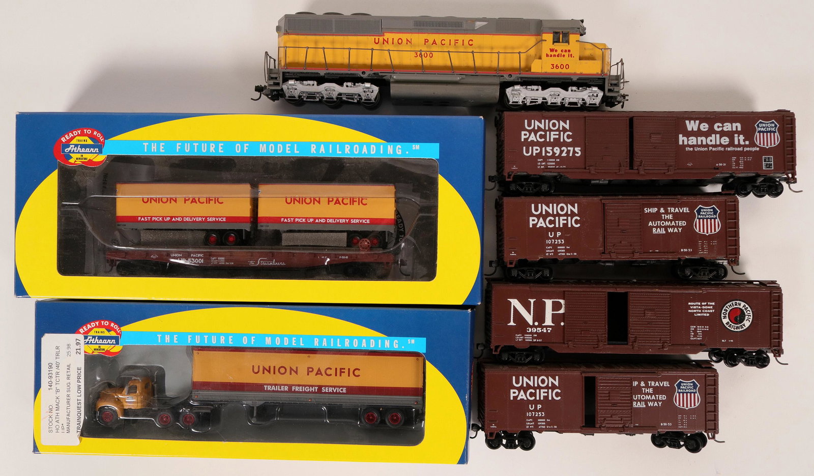 Model Train: U.P. Freight train (121035): Loco and 7 rolling stock. Athearn SD45 Union Pacific #3600 in good condition, but not tested. Three Union Pacific box cars and one Northern Pacific 50[x=#8217/] box car. One NIB Athearn Mack TCTR and 