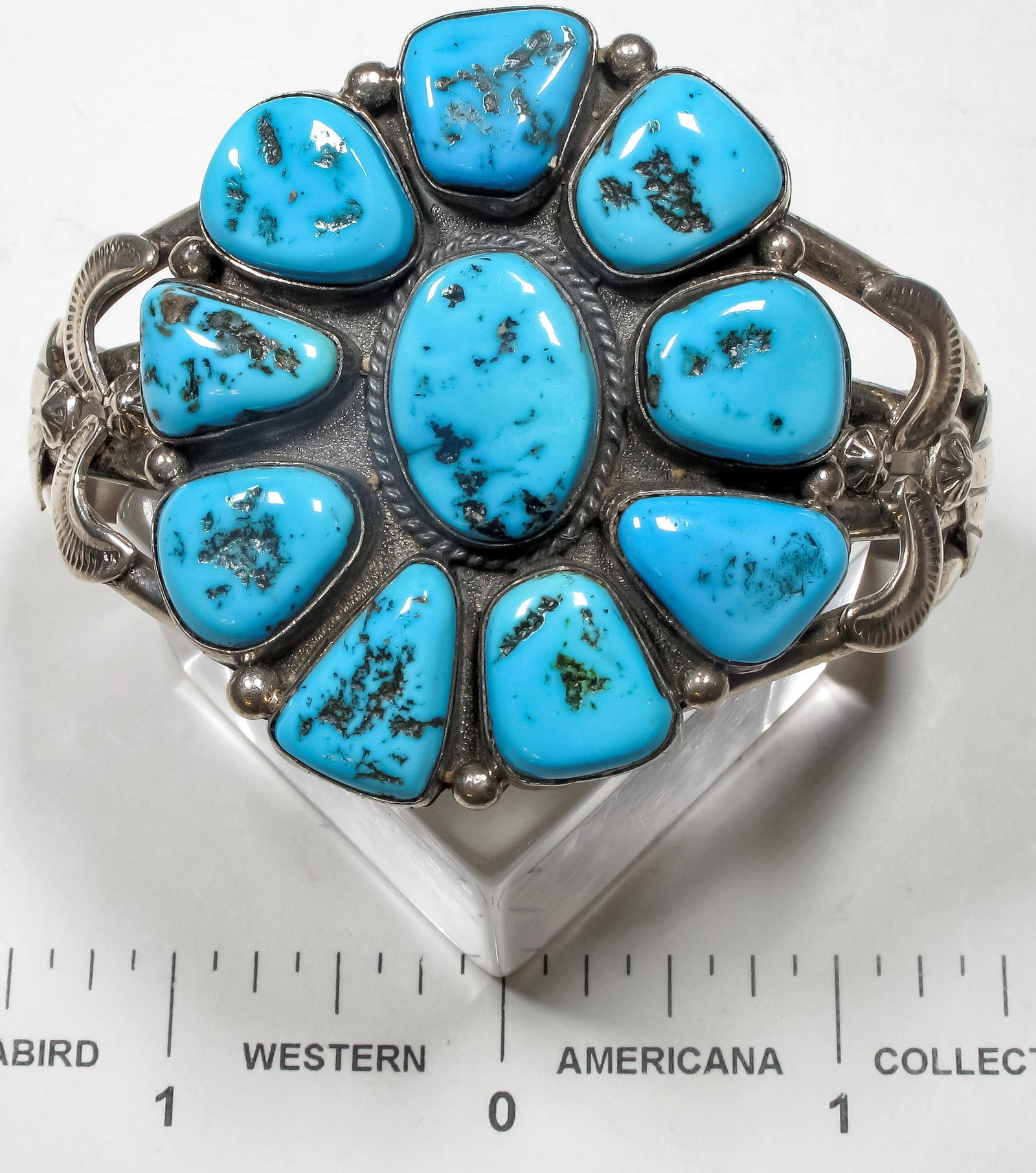 Ella Peter Turquoise Cluster Bracelet (125168): This is a turquoise bracelet by well known Navajo silversmith Ella Peter, these are beautiful darker blue turquoise stones, center stone is about [x=#190/][x=#8221/] and others about [x=#189/][x=#8221