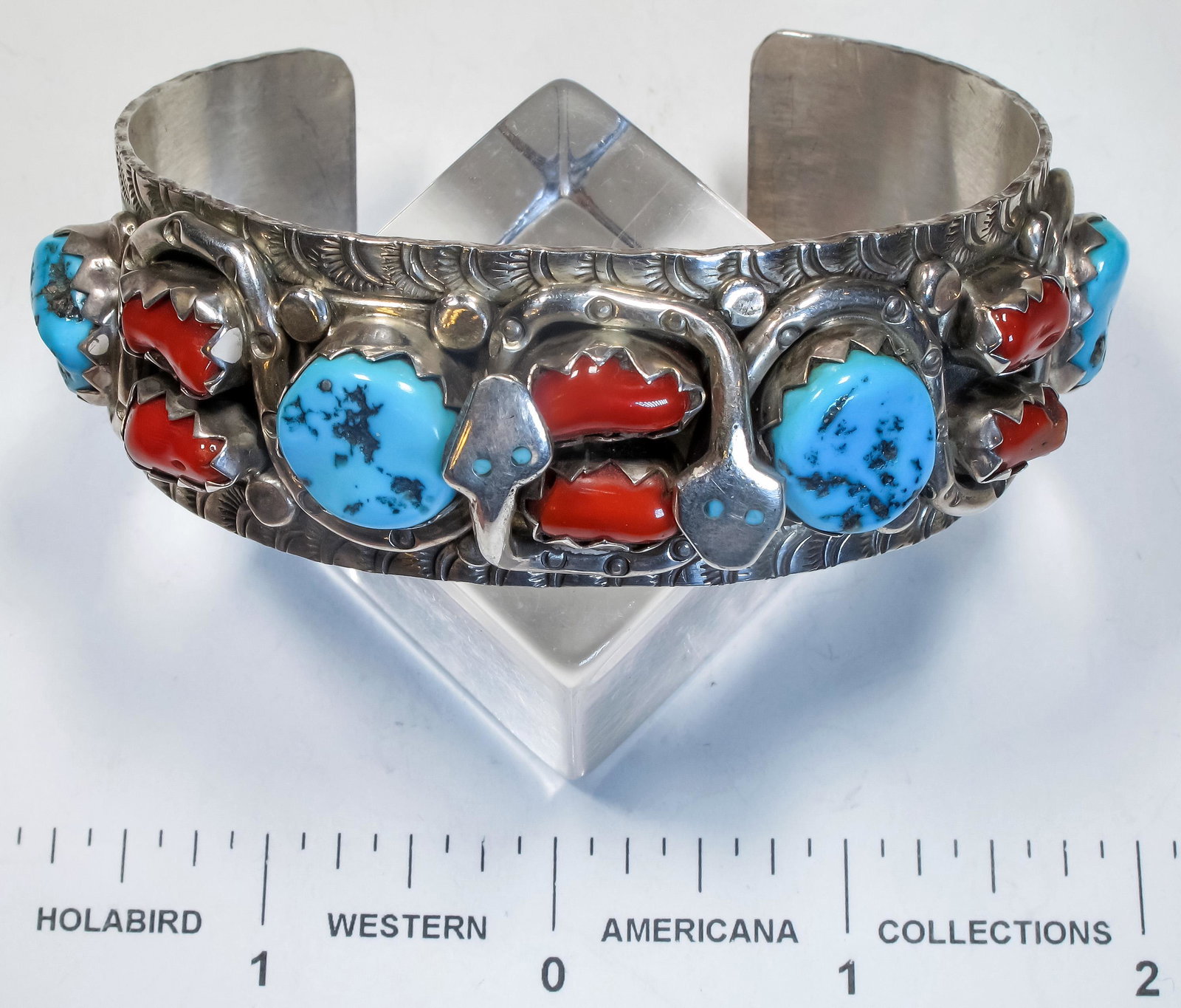 Large Size Turquoise and Coral Bracelet w/ Snake Motif: This is a large size bracelet with a 1 [x=#189/][x=#8221/] band opening, the piece incorporates nice turquoise stones at about [x=#189/][x=#8221/] in size along with dark red coral stones with two sna