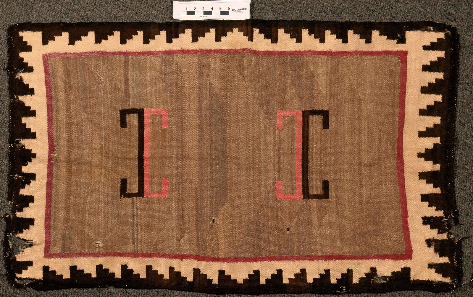 Navajo Saddle Blanket (108727): Double saddle blanket, approx. 52" x 33". Early 20th century. Ends frayed quite a bit, some small holes, many lazy lines. Ganado style, storm cloud border.Good condition--please see photos.Date: Count