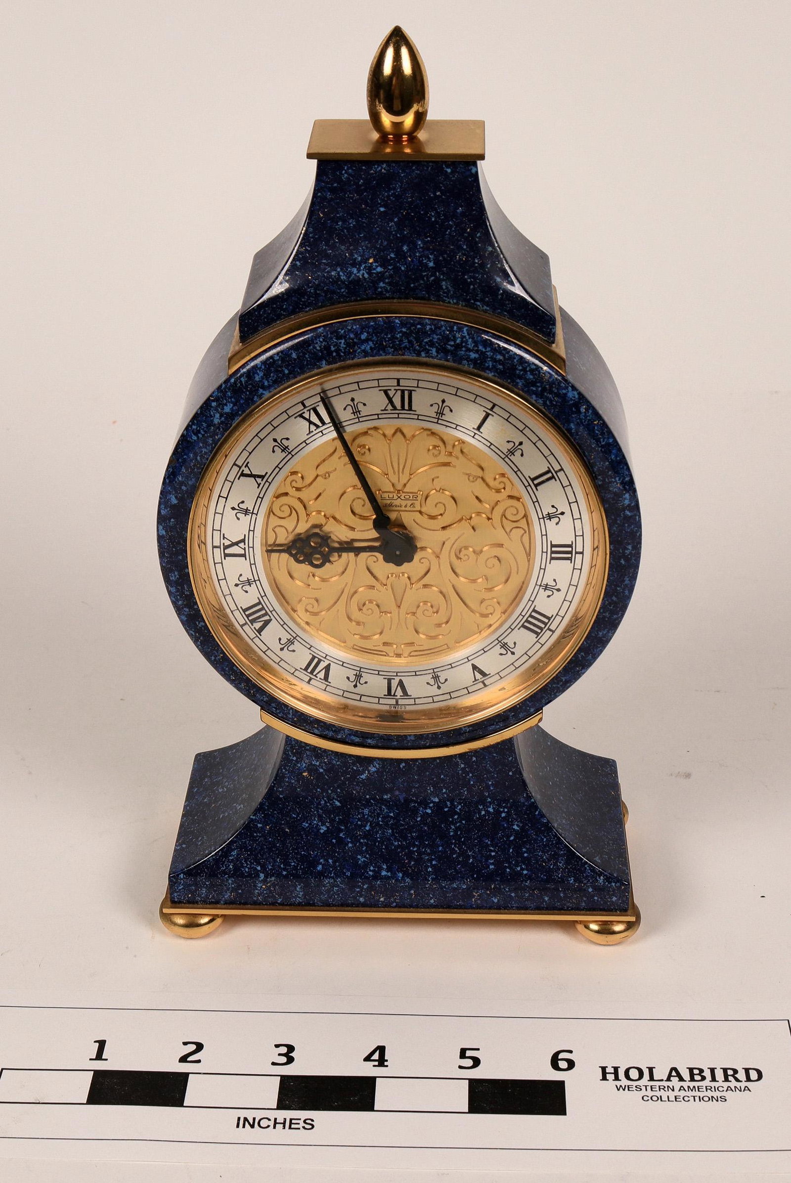 Faux Lapis Clock by Luxor, Shreve & Co. (108669): Table clock made of a synthetic stone material colored to look like lapis lazuli, even down to the tiny flecks of gold. The clock will tick quietly when wound, and the knob on the back will set the ti