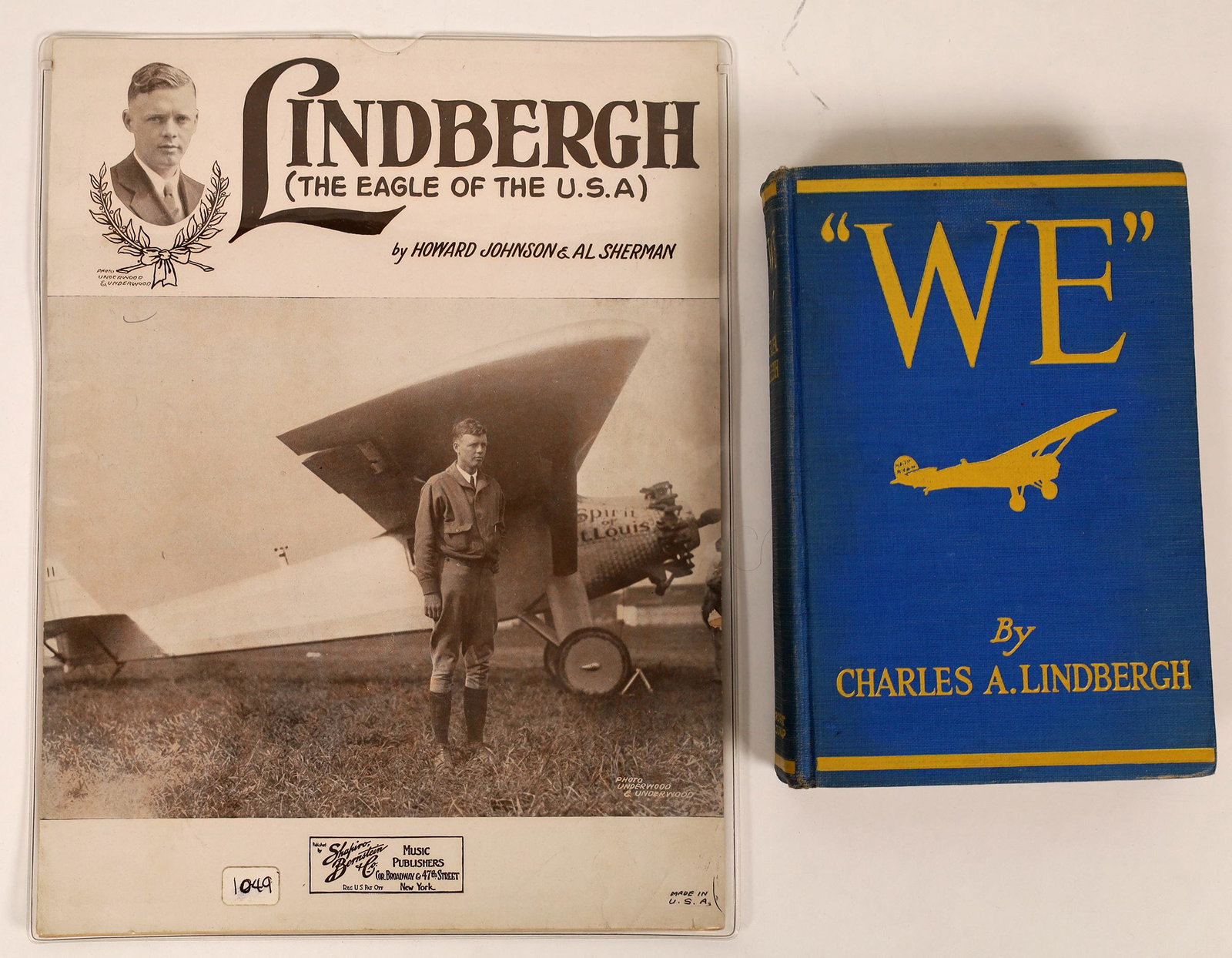 Charles Lindbergh Book & Sheet Music (119330): A copy of the Charles Lindbergh book, "We" and a copy of sheet music featuring the song by Howard Johnson & Al Sherman.entited, appropriately enough, "Lindbergh." Both the book and music are in good c
