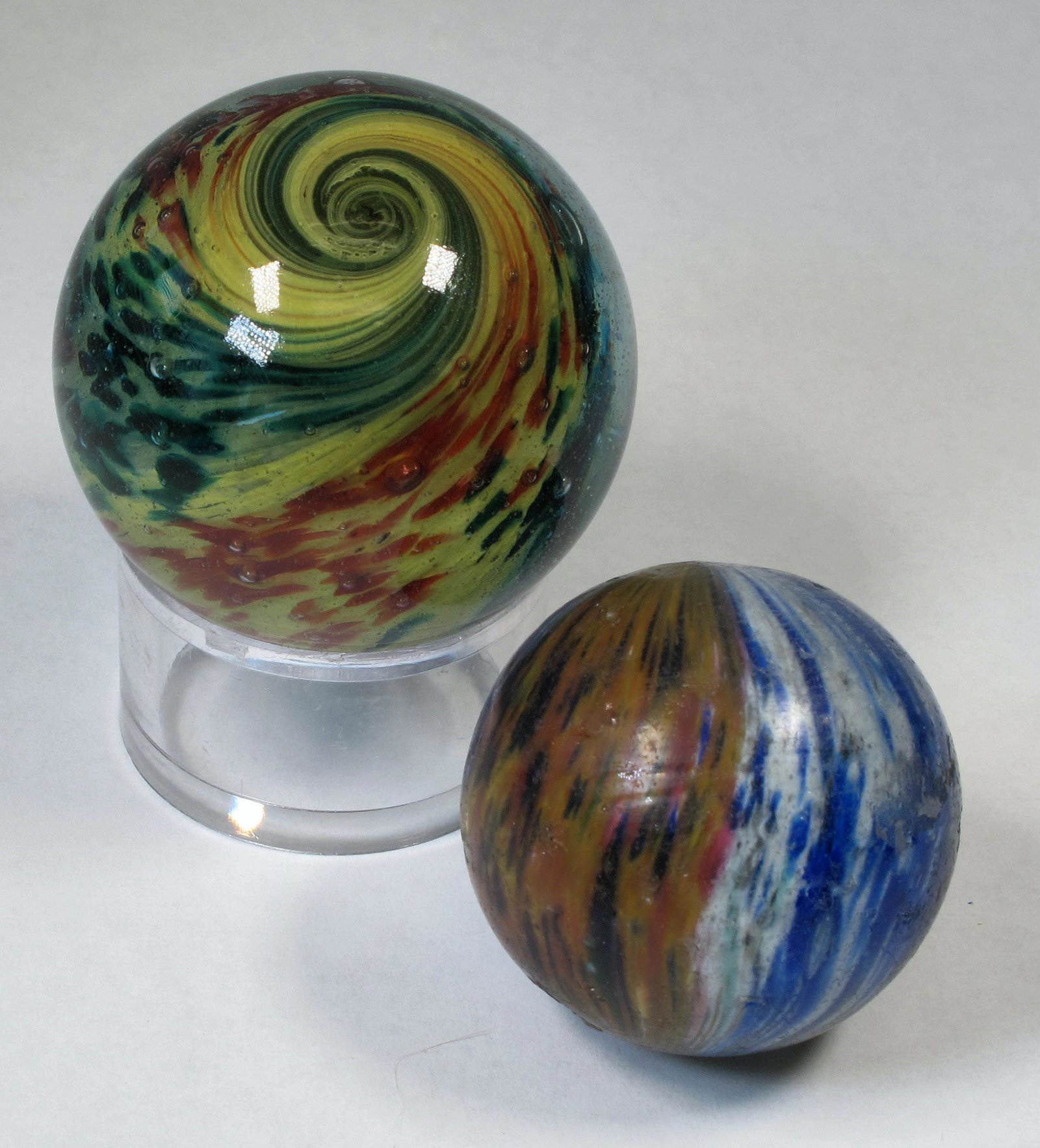 Onionskin Marbles, Large Paneled - 2 (125380): 1. 2" lobed, paneled onionskin. Panels are yellow/red and yellow/green. Panels are shallow in the yellow/green panels. Marble has been polished, pontils removed but interior glass intact. Displays ver